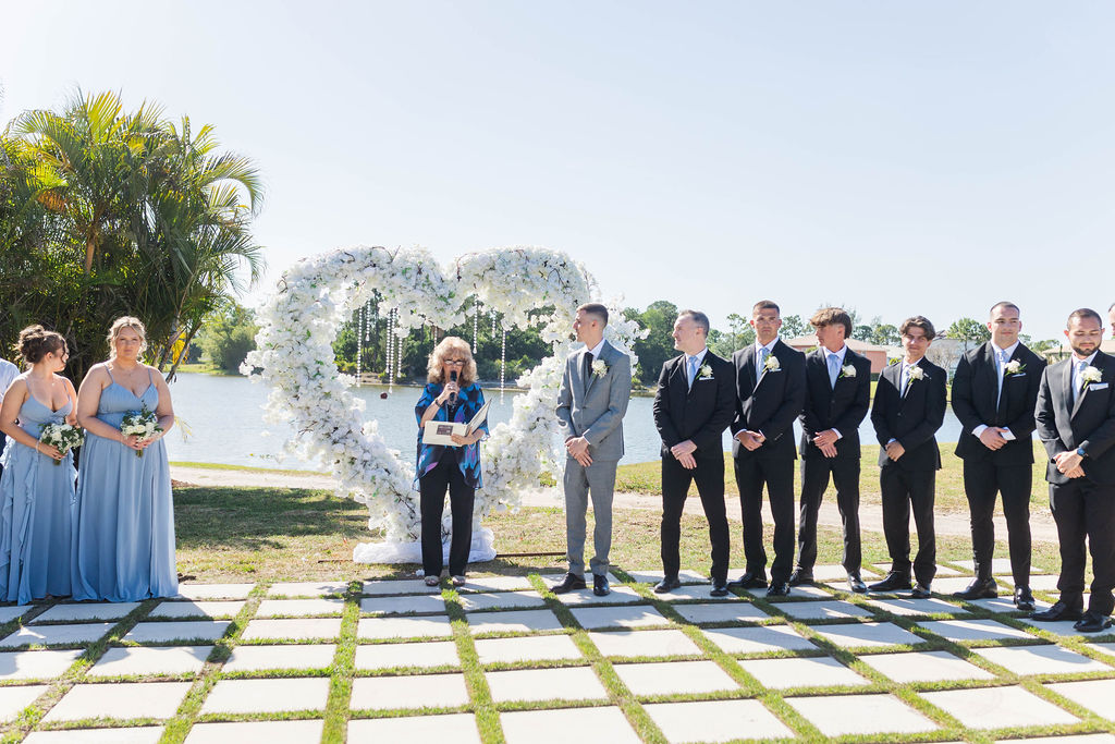 Palm Beach Florida wedding venue ceremony with bridesmaids, groomsmen and waterfront views at an all inclusive country club wedding venue in Southern Florida