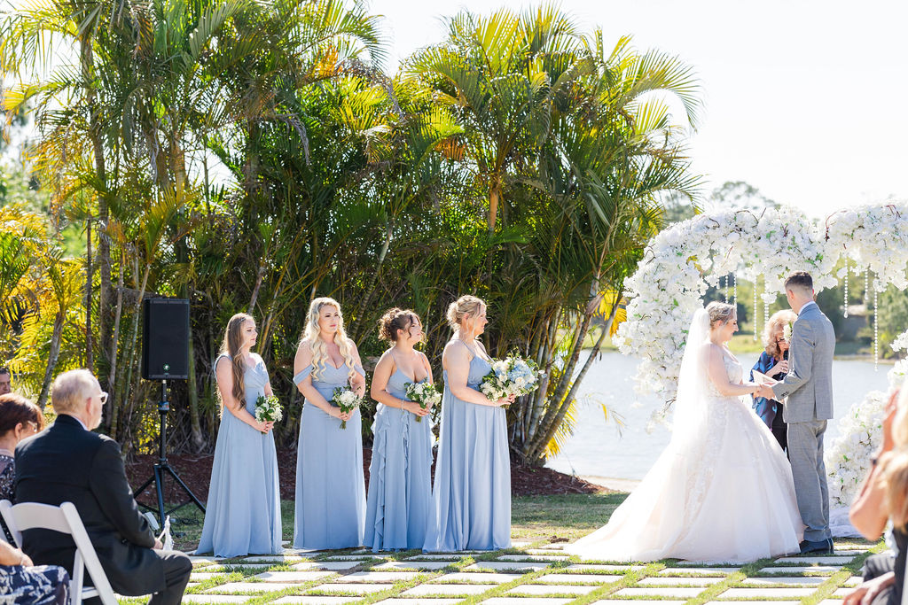 Palm Beach Wedding Venue, bridesmaids dresses and luxury flowers at an outdoor wedding ceremony