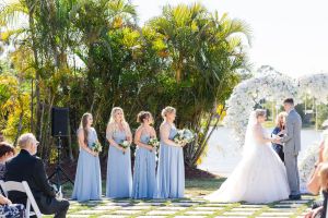 Palm Beach Wedding Venue, bridesmaids dresses and luxury flowers at an outdoor wedding ceremony