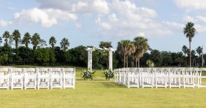 Palm Beach Florida wedding venue outdoor ceremony with luxury chairs and arch