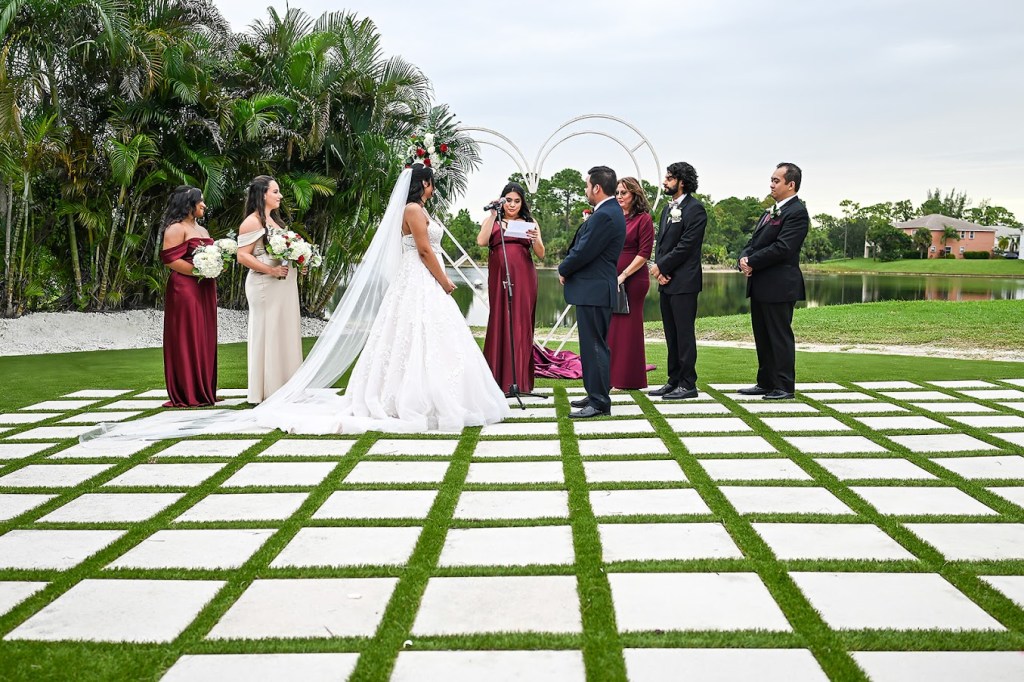 20 Questions to Ask Your Palm Beach Wedding Photographer Before Booking, Outdoor wedding ceremony bride & groom exchange vows 